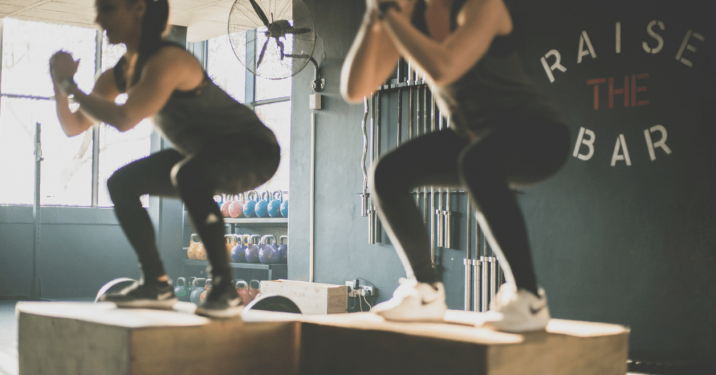 two women box jumping